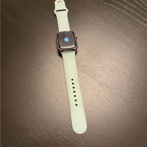 Apple Smartwatch with Gold Case and Light Green Band